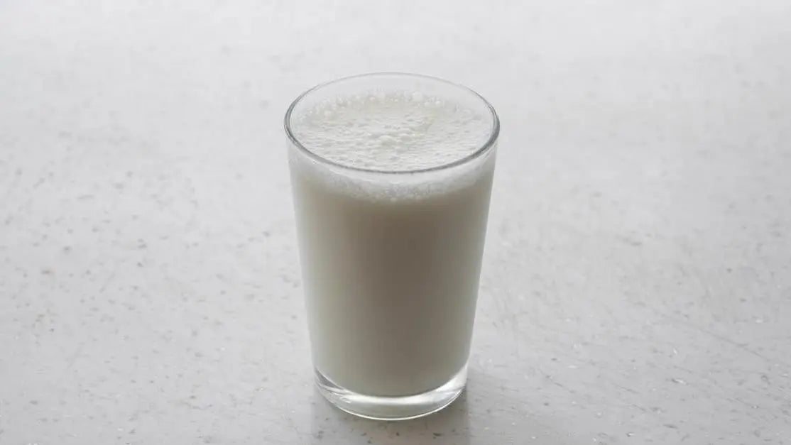 Lactic acid vs glycolic acid: minimalist frothy milk visual for skincare acid comparison